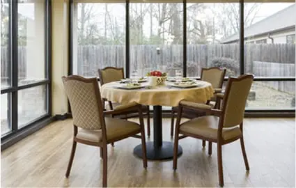 Dining table with chairs around it